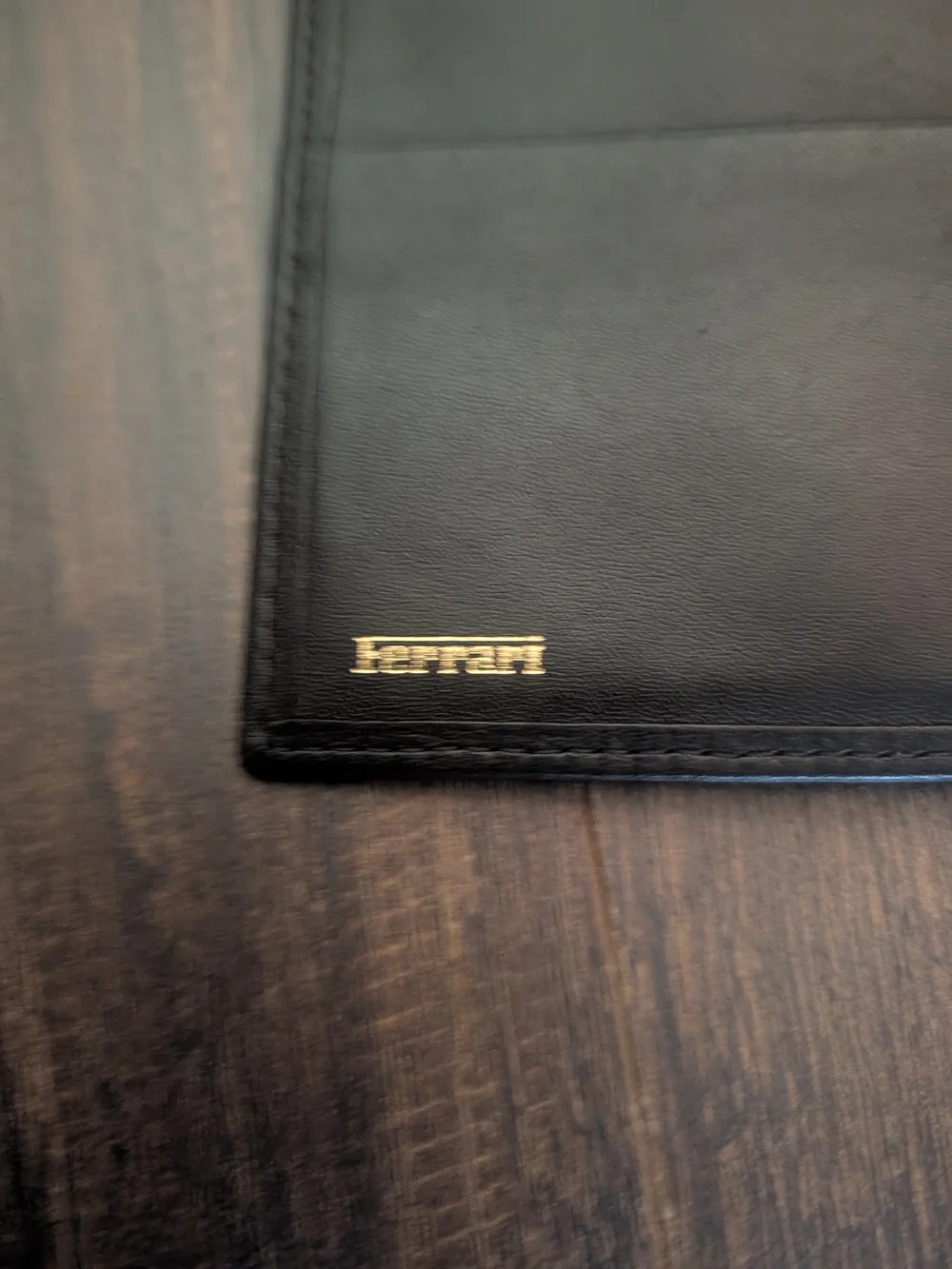 FERRARI Black Leather Passport Wallet with Embossed Shield Logo Red Inside